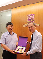 Prof. Fok Tai-fai, Pro-Vice-Chancellor of CUHK (right) presents a souvenir to Prof. Liu Jiongtian